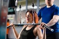 Woman train hands in gym with trainer Royalty Free Stock Photo