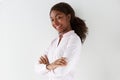 Attractive young african american woman smiling with arms crossed on white background Royalty Free Stock Photo