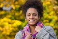 Attractive young african american woman smiling in autumn Royalty Free Stock Photo