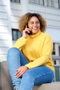 Attractive young african american woman talking on cellphone in city Royalty Free Stock Photo