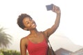 Attractive young african woman taking a selfie Royalty Free Stock Photo