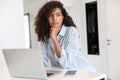 Attractive young african woman working on laptop computer Royalty Free Stock Photo