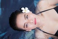 Attractive young asia woman floating in a swimming pool Royalty Free Stock Photo