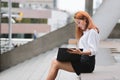 Attractive young Asian business woman looking document files in hands at outdoors Royalty Free Stock Photo