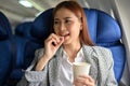 Attractive young asian businesswoman passenger taking pill of an airsick motion sickness Royalty Free Stock Photo