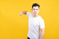 Attractive young asian man hold fist fury and angry negative emotion wearing white t-shirt Royalty Free Stock Photo