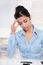 Attractive young asian secretary has migraine or headache. Royalty Free Stock Photo