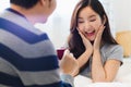 Attractive young Asian smile couple man offer wedding ring to happy and excited woman for marriage proposal in romantic moment. Lo Royalty Free Stock Photo