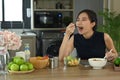 Attractive asian woman enjoying her vegan meal. Healthy vegan diet concept. Royalty Free Stock Photo