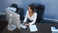 Attractive young asian woman working in a call center Royalty Free Stock Photo