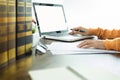 Attractive Young beautiful entrepreneur Woman smiling and looking at laptop screen, Working from Home. Royalty Free Stock Photo