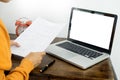 Attractive Young beautiful entrepreneur Woman smiling and looking at laptop screen, Working from Home Royalty Free Stock Photo