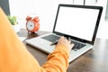 Attractive Young beautiful entrepreneur Woman smiling and looking at laptop screen, Working from Home Royalty Free Stock Photo