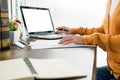 Attractive Young beautiful entrepreneur Woman smiling and looking at laptop screen, Working from Home Royalty Free Stock Photo