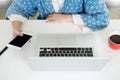 Attractive Young beautiful entrepreneur Woman smiling and looking at laptop screen, Working from Home Royalty Free Stock Photo