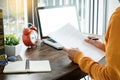 Attractive Young beautiful entrepreneur Woman smiling and looking at laptop screen, Working from Home Royalty Free Stock Photo