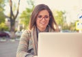 Attractive woman using laptop outside Royalty Free Stock Photo