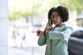 Attractive young black woman getting late for business meeting Royalty Free Stock Photo