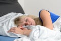 Attractive young blond woman sleeping in her bed Royalty Free Stock Photo