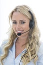 Attractive Young Business Woman Using a Telephone Headset Royalty Free Stock Photo