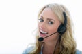 Attractive Young Business Woman Using a Telephone Headset Royalty Free Stock Photo