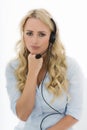 Attractive Young Business Woman Using a Telephone Headset Royalty Free Stock Photo