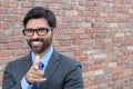 Attractive young businessman pointing a finger towards you Royalty Free Stock Photo