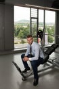 Attractive Young Businessman Resting Relaxed In Gym Royalty Free Stock Photo