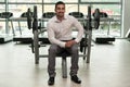 Attractive Young Businessman Resting Relaxed In Gym Royalty Free Stock Photo