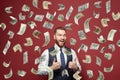 Attractive young businessman winner with American US dollar money Royalty Free Stock Photo