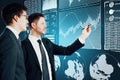 Attractive young businessmen with business interface Royalty Free Stock Photo