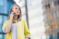 Attractive young businness woman with smart phone in the city Royalty Free Stock Photo