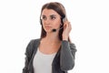 Attractive young call center office girl with headphones and microphone posing isolated on white background Royalty Free Stock Photo