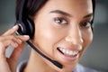 Im always ready to help. an attractive young call centre agent wearing a headset in the office during the day. Royalty Free Stock Photo