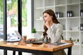 Attractive young caucasian businesswoman working on her project on laptop Royalty Free Stock Photo