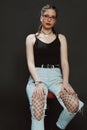 Attractive young caucasian girl posing in studio on isolated background. Style, trends, fashion concept. Royalty Free Stock Photo