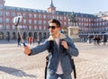 Handsome young student tourist man happy and excited taking a selfie in Madrid, Spain Royalty Free Stock Photo