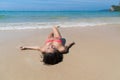 Attractive Young Caucasian Woman In Swimsuit Lying On Beach, Girl Wet Sand Sea Ocean Holiday Royalty Free Stock Photo