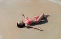 Attractive Young Caucasian Woman In Swimsuit Lying On Beach Top View, Girl Wet Sand Sea Ocean Holiday Royalty Free Stock Photo