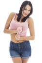 Attractive Young Caucasian Woman Wearing A Pink Vest Top and Blue Denim Shorts Royalty Free Stock Photo