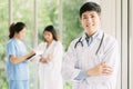 Asian male doctor in front of medical staffs Royalty Free Stock Photo