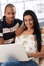 Attractive young couple browsing internet at home Royalty Free Stock Photo