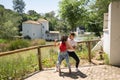 Attractive young couple dancing sensual bachata in an outdoor park with a river in the background. Latin, sensual, folkloric, Royalty Free Stock Photo