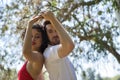 Attractive young couple dancing sensual bachata in an outdoor park, surrounded by trees, next to a river. Latin, sensual, Royalty Free Stock Photo