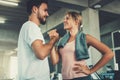 Attractive young couple handshaking after workout in fitness gym., Portrait of man and woman couple love are working out training Royalty Free Stock Photo