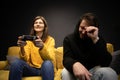 Attractive young couple having fun playing video games console joysticks Royalty Free Stock Photo