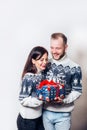 Attractive young couple holding gift over white background Royalty Free Stock Photo