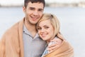 Attractive young couple standing on beach at summer. Royalty Free Stock Photo