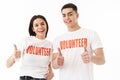 Attractive young couple standing isolated over white