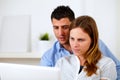 Attractive young couple using laptop together Royalty Free Stock Photo